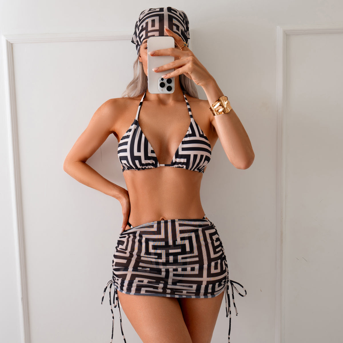 Stylish Black and White Geometric Print Bikini Set with Matching Cover-Up Skirt