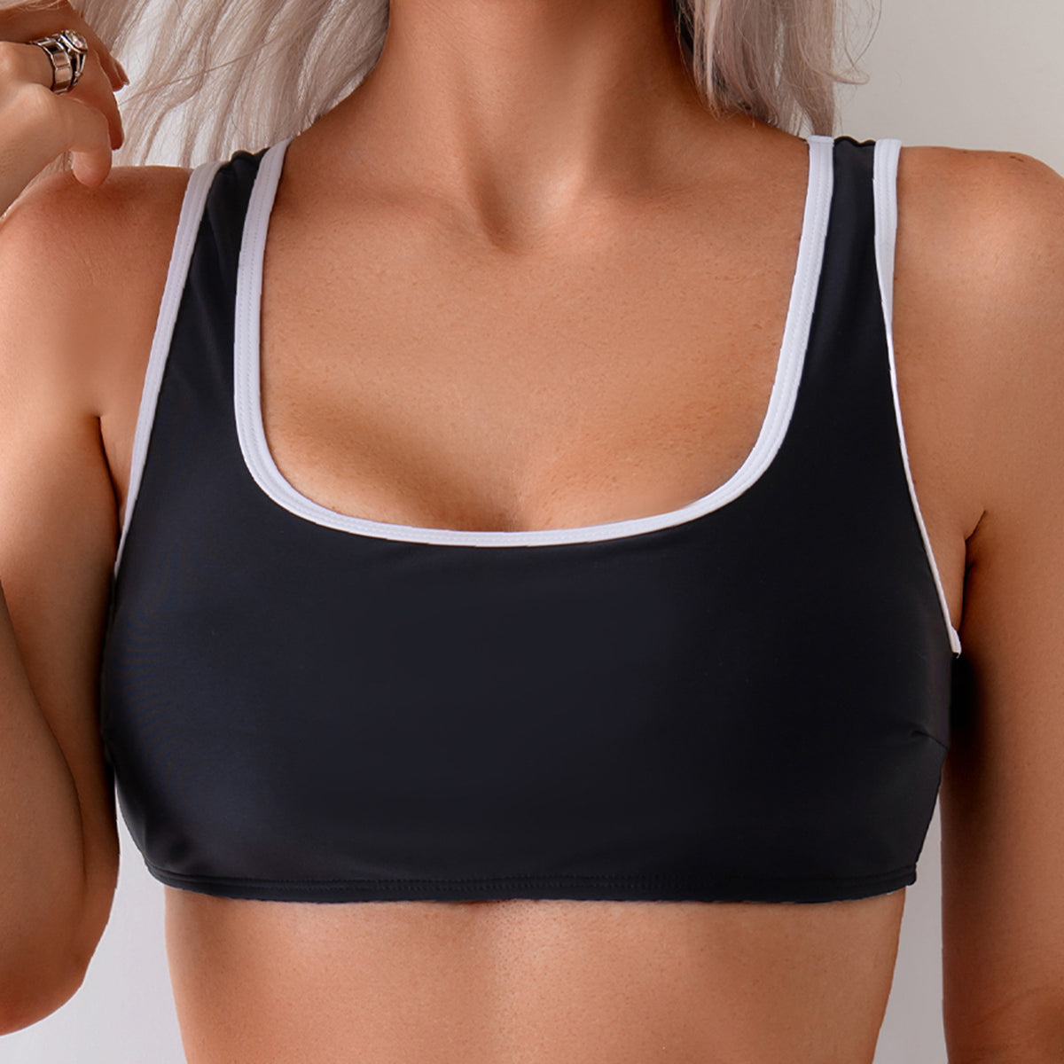 Classic Black Two-Piece Swimsuit with White Trim and High-Cut Bottom