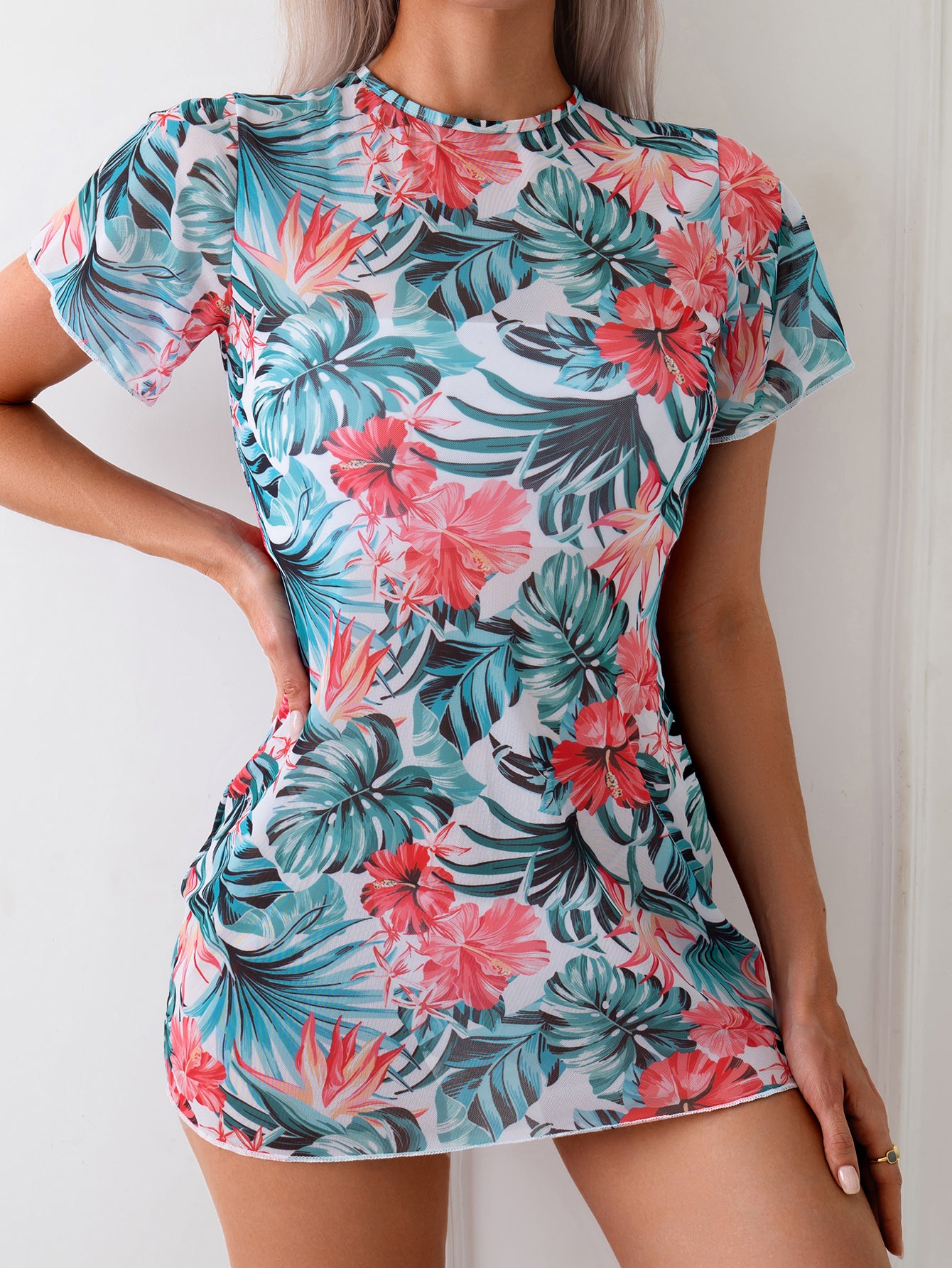 Stylish Coral One-Piece Swimsuit with Deep V-Neck and Tie-Back Design