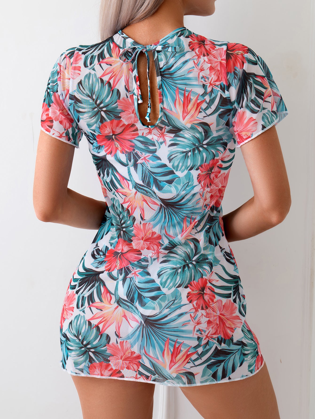Stylish Coral One-Piece Swimsuit with Deep V-Neck and Tie-Back Design